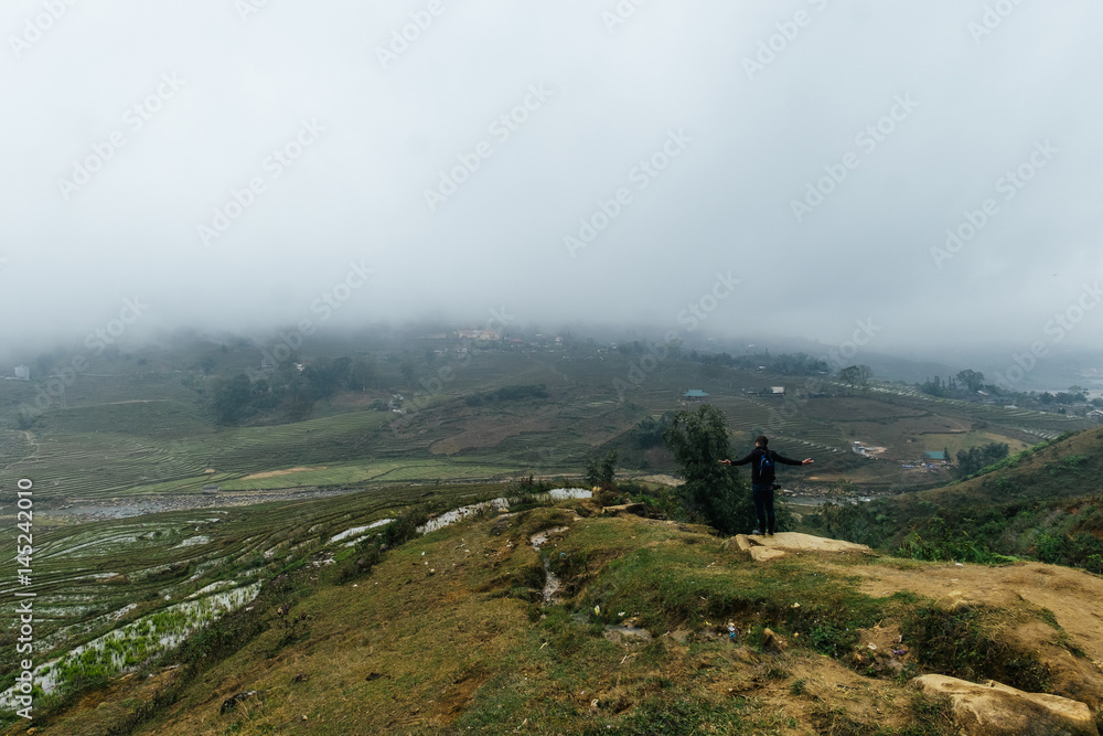 Fototapeta premium Fog covers fields of rice in Vietnam