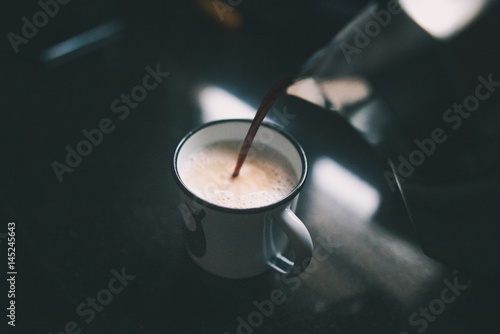 Pouring Coffee In A Mug photo