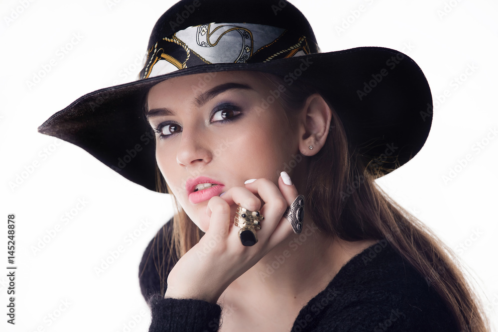Closeup fashion portrait of young beautiful girl brunette fashion girl posing in Studio,holding retro felt hat popular until the 60-ies.fashion Closeup fashion portrait of young beautiful girl brunette fashion girl posing in Studio,holding retro felt hat popular until the 60-ies.fashion