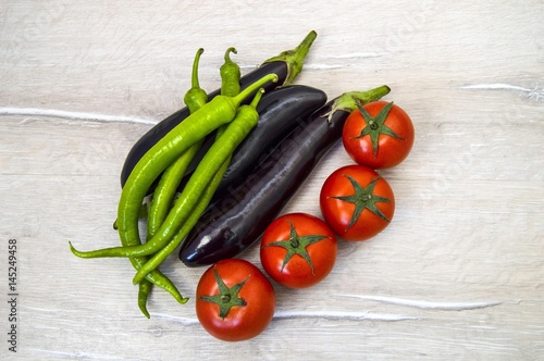 Natural tomatoes, green peppers and aubergines, vegetable paintings in different concepts, intestinal tomatoes and peppers, fresh tomatoes and green peppers,
