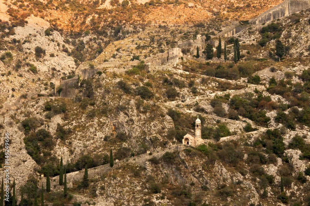 Mountainsides of Kotor, Montenegro, and the Church of Our Lady of Remedy, along the path to St Johns Fortress Mountainsides of Kotor, Montenegro, and the Church of Our Lady of Remedy, along the path to St Johns Fortress