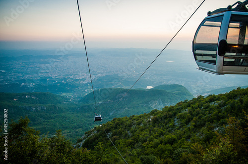 2016 Albania Tirana view from Dali moutain to the city. Line trolleyin an evening sun