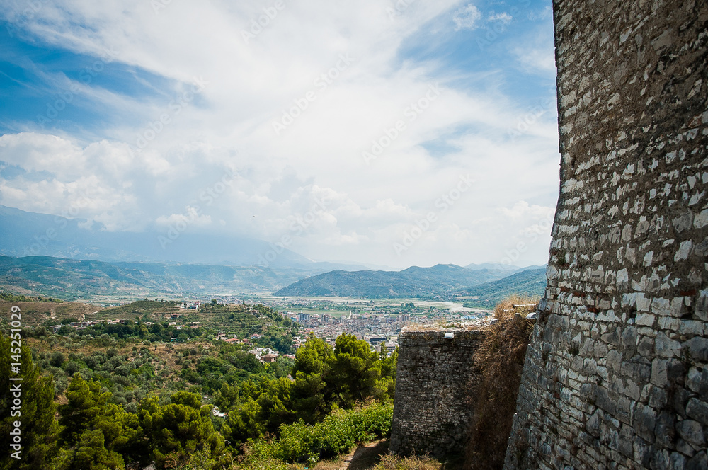 2016 Albania Berat - City of thousand windows, beautifull view of town on the hill between a lot of trees and blue sky