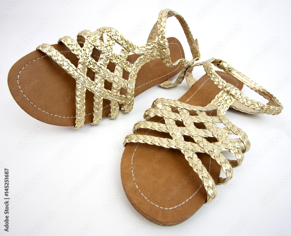 Fototapeta premium Gold sandals.