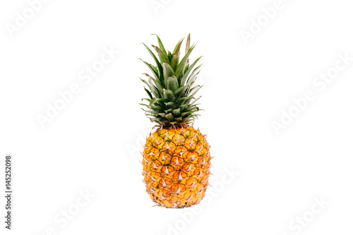 Whole ripe pineapple isolated on white background closeup. Tropical fruit.