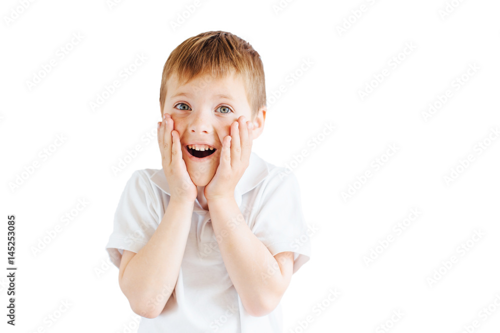 Little boy stand on white background and show his emotions Little boy stand on white background and show his emotions