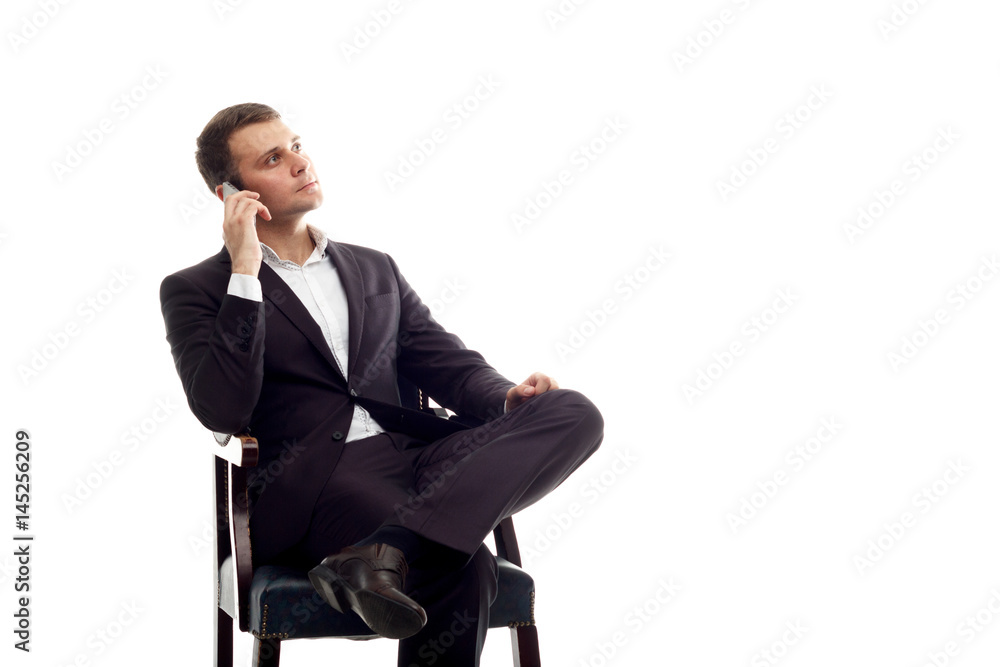 young sitting business man talking phone on white young sitting business man talking phone on white