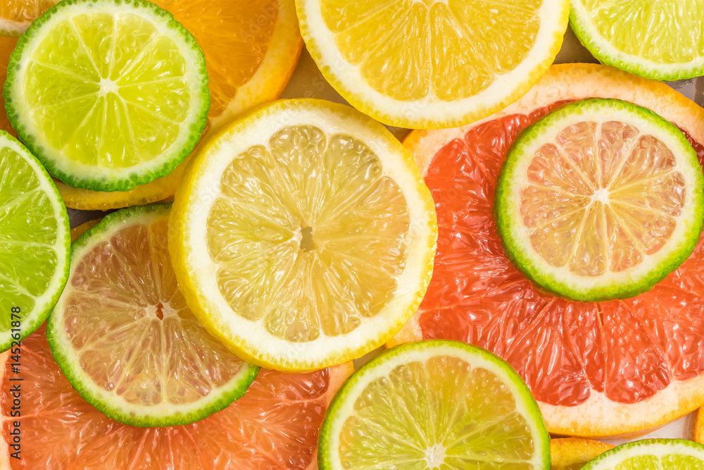 Grapefruit, lime, lemon, and orange slices background Grapefruit, lime, lemon, and orange slices background