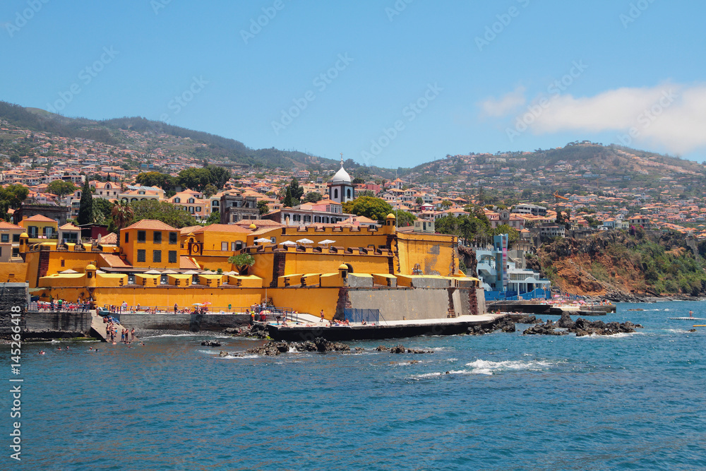 City beach and ancient fortress. Funchal, Madeira, Portugal