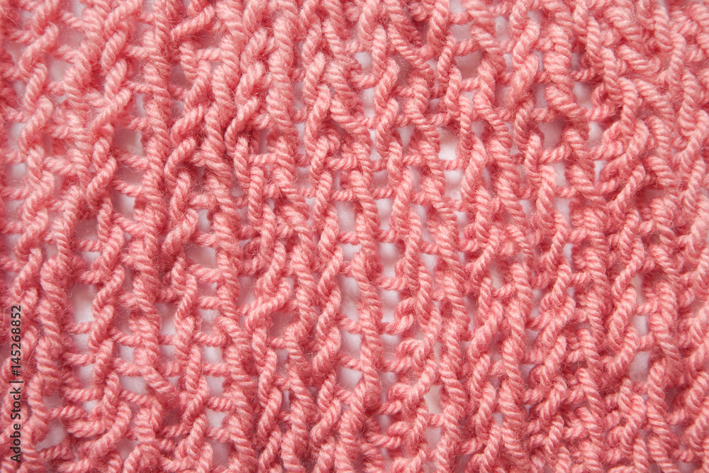 Knitting pink textured wool background Knitting pink textured wool background