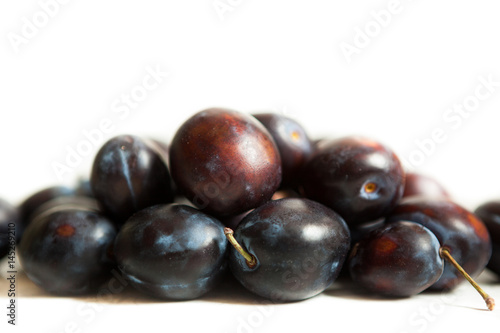 Plums isolated on white