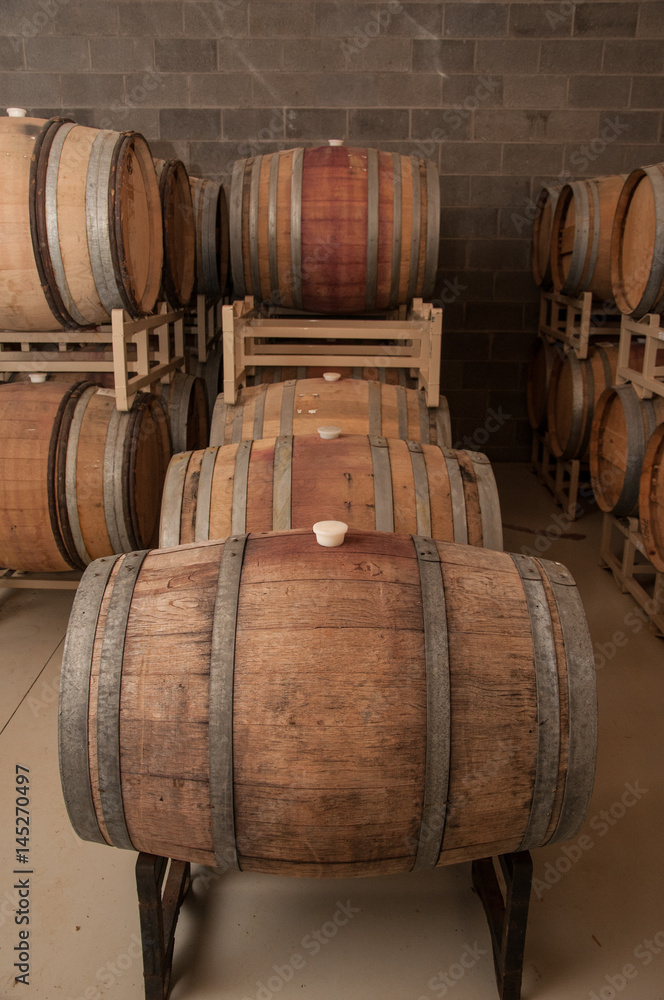 Wine casks aging in a cellar