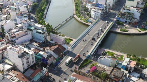 HO CHI MINH CITY  VIETNAM - 19 March  2016: Aerial sunshine view of rooftop skyscraper on Nhieu Loc canal in Ho Chi Minh city, Vietnam photo