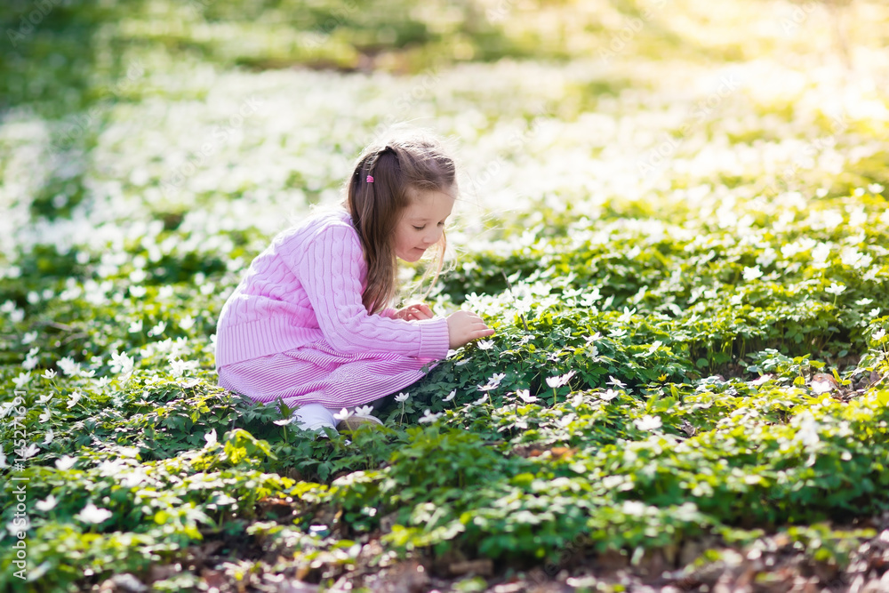 Child in spring park with flowers Child in spring park with flowers