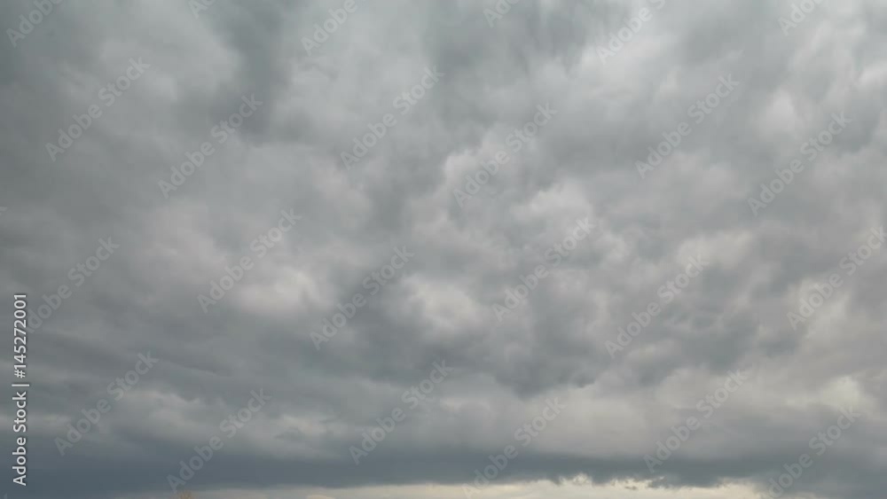 Russia, time lapse. Formation and rapid movement of white clouds of different shapes in the blue sky in late spring at sunset. Russia, time lapse. Formation and rapid movement of white clouds of different shapes in the blue sky in late spring at sunset.