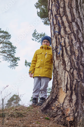 boy in a yellow jacket