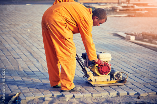 Construction of road coverings of blocks on the road section.