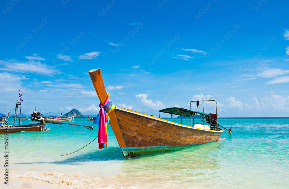 Long tailed boat at Phi-phi island in Thailand Long tailed boat at Phi-phi island in Thailand