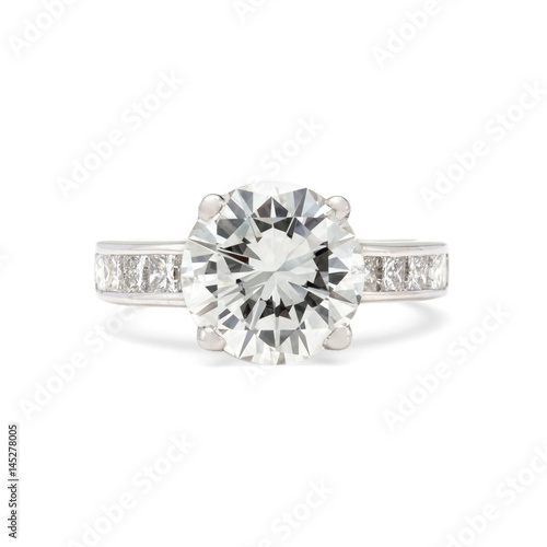 Engagement ring, big round brilliant with side stones on white background