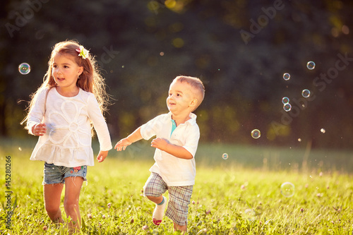 Cheerful children running together