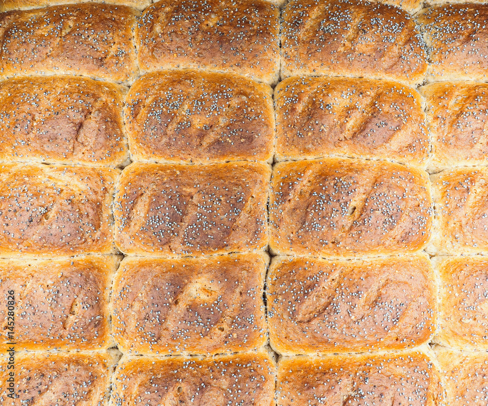 Fototapeta premium Closeup of baked rolls with poppy seeds