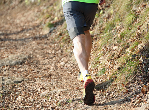 athlete running on the trail