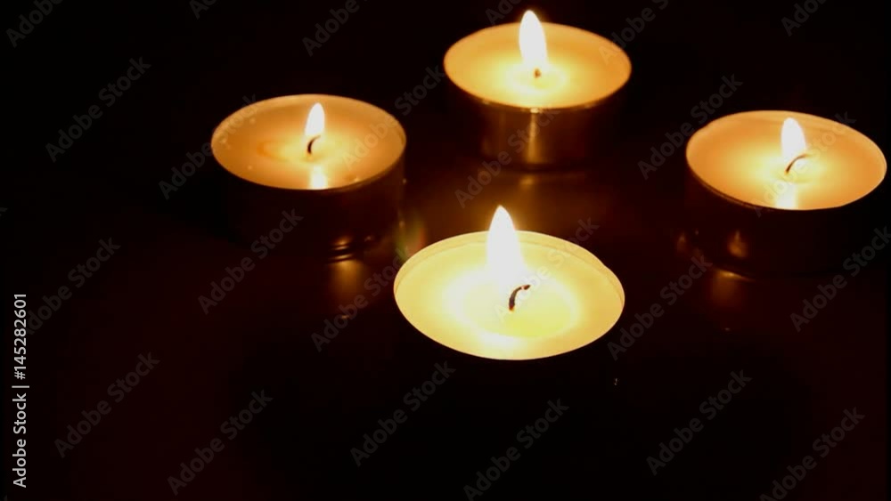 Closeup of Burning Candles With Reflection on Dark Wooden Table Background Closeup of Burning Candles With Reflection on Dark Wooden Table Background