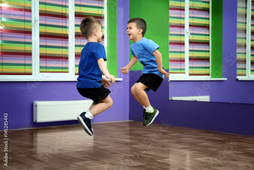 Little boys jumping in chor...