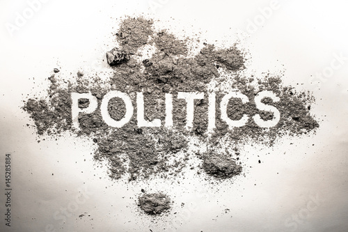 Politics word in ash, dirt, filth, dust as bad government, rule, economy or dangerous society system or corruption and democracy concept background photo