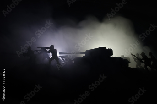 Tanks in the conflict zone. The war in the countryside. Tank silhouette at night. Battle scene. © zef art