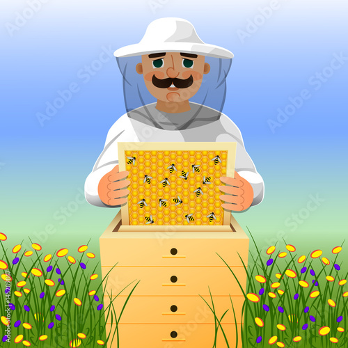 Beekeeper on apiary. A man in a white beekeeper suit works near a beehive. Sunny summer day on a flowering meadow.
