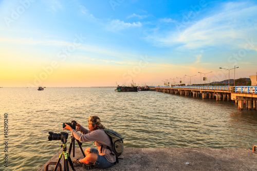 Taking sunset picture photo