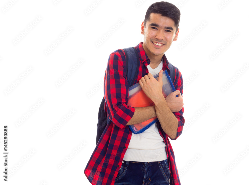 Young man with backpack and copy-books Young man with backpack and copy-books