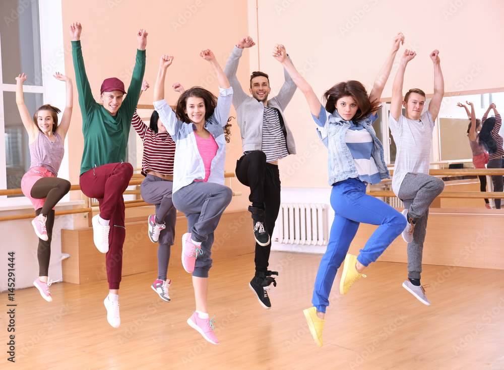 Fototapeta premium Group of young hip-hop dancers in studio