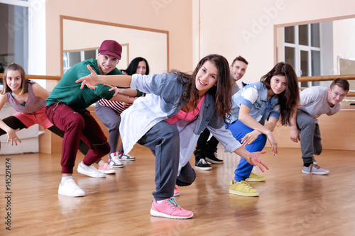 Group of young hip-hop dancers in studio photo