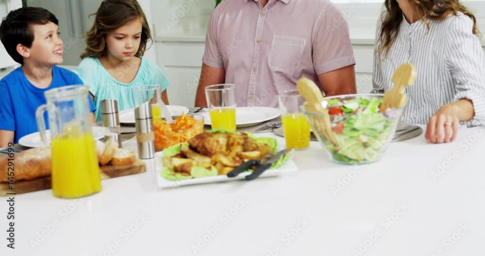 Family having healthy meal together at home Family having healthy meal together at home
