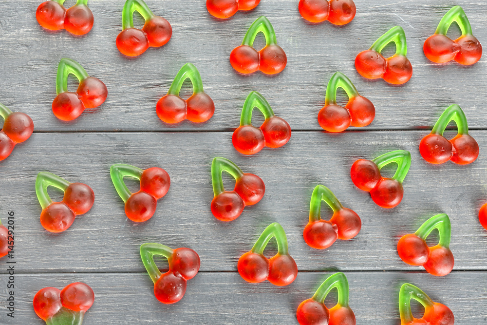 Tasty jelly candies on wooden background Tasty jelly candies on wooden background
