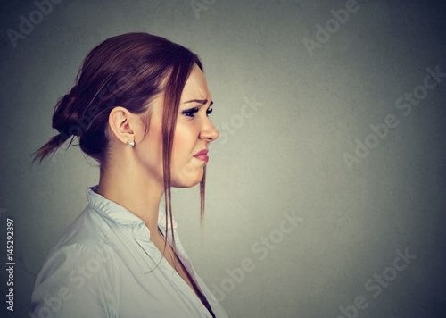Quadro su tela Side profile disgusted annoyed young woman