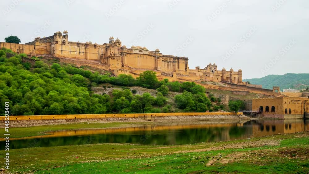 Jaipur, India. Walking towards the Amber Fort in Jaipur, India. Popular landmark, reflection in the water during the cloudy day. Time-lapse Jaipur, India. Walking towards the Amber Fort in Jaipur, India. Popular landmark, reflection in the water during the cloudy day. Time-lapse