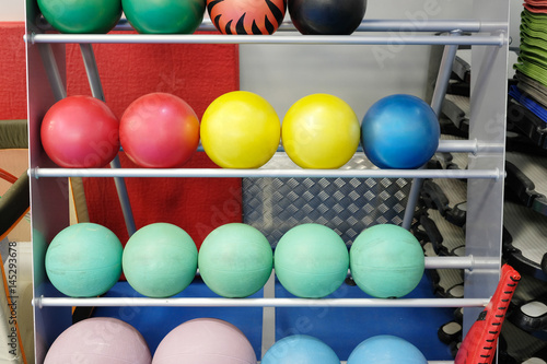 Balls on a stand in a fitness hall