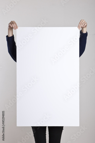 woman hand hold a blank poster