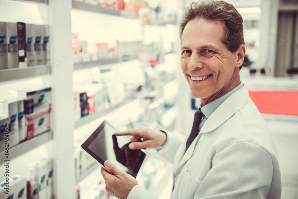 Handsome pharmacist working