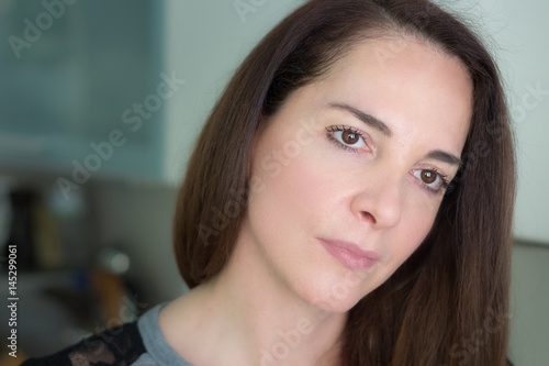 Portrait of a mature woman thinking looking away.