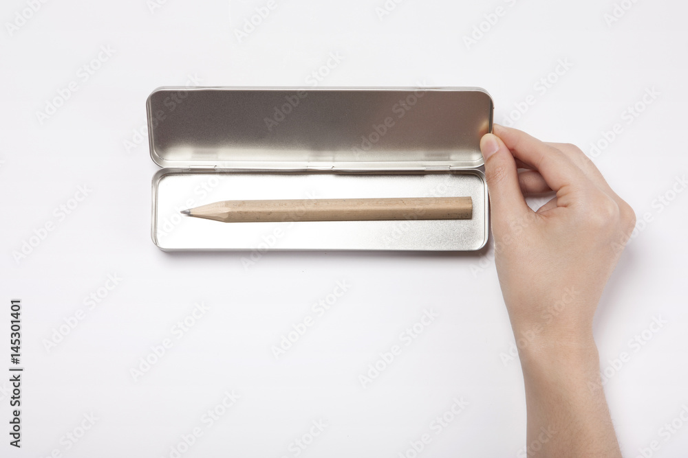 woman hand hold a pencil case isolated white. woman hand hold a pencil case isolated white.