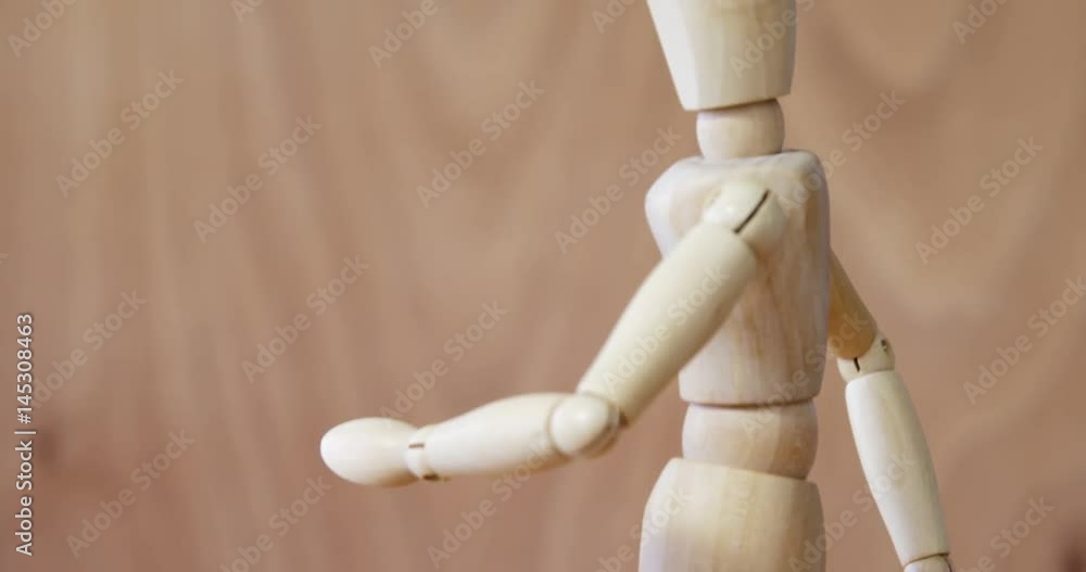 Wooden figurine walking on wooden floor Wooden figurine walking on wooden floor