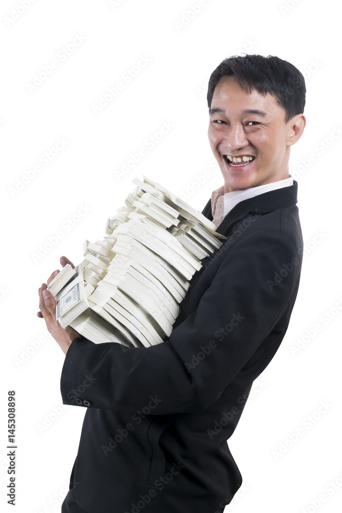The young businessman stand sideways to the right and turned to smile with a large amount of money in his arms The young businessman stand sideways to the right and turned to smile with a large amount of money in his arms