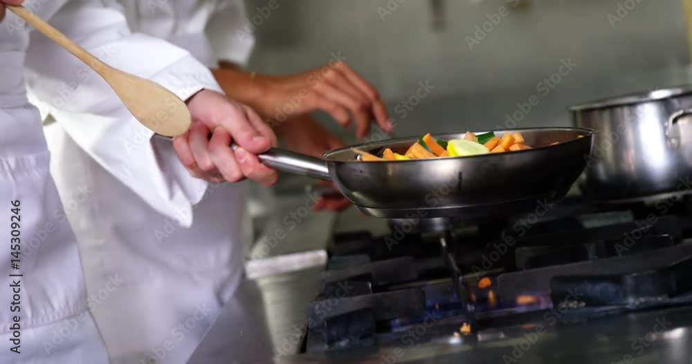 Chef preparing food in the kitchen Chef preparing food in the kitchen