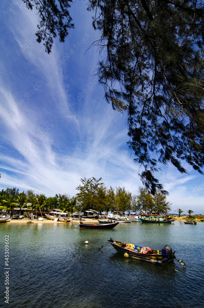 Beautiful traditional fisherman village located at Terengganu, Malaysia at sunny day with blue sky background.