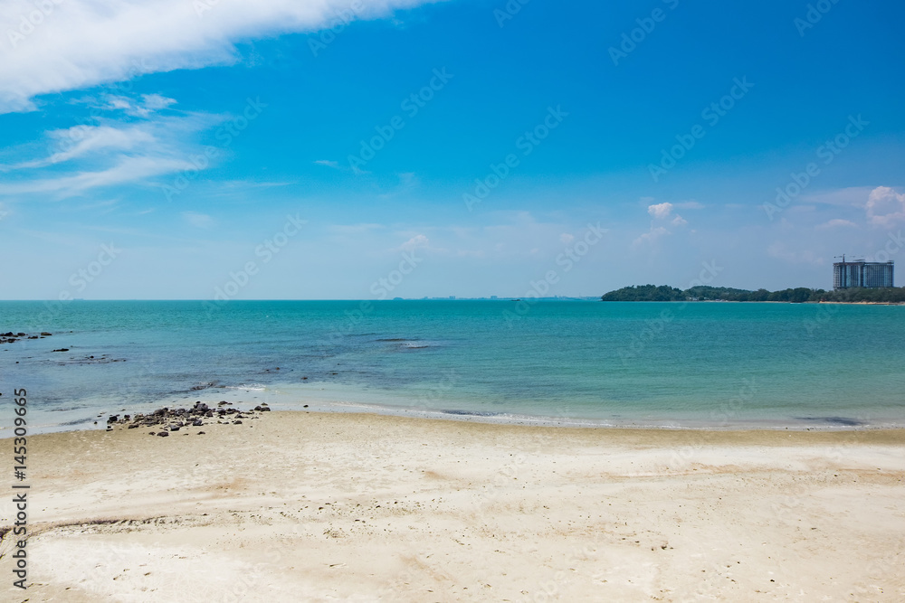 Beautiful tropical beach at sunny day with blue sky background and white deserted sand