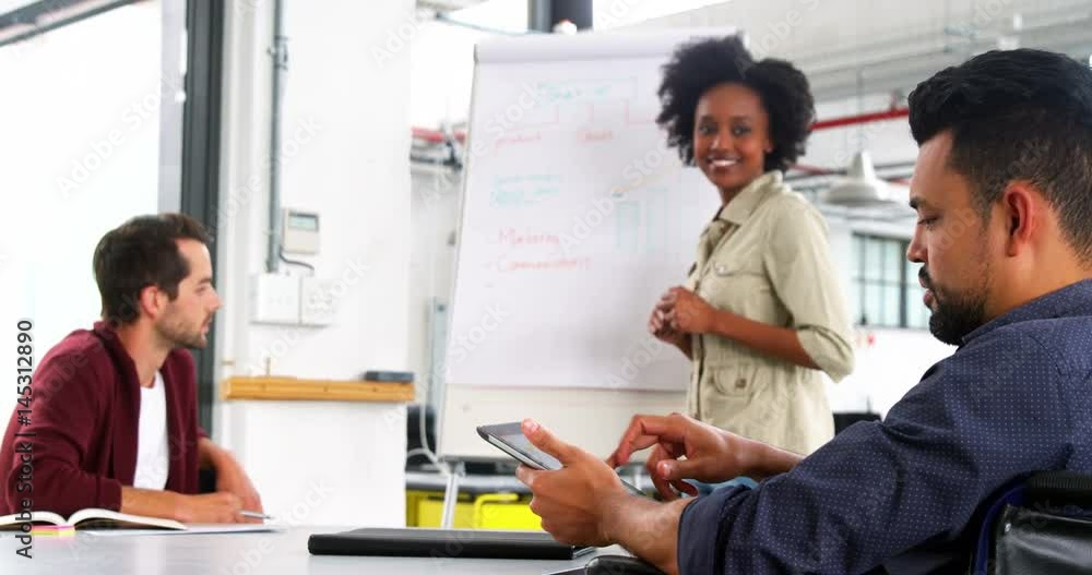 Business executives discussing during meeting Business executives discussing during meeting